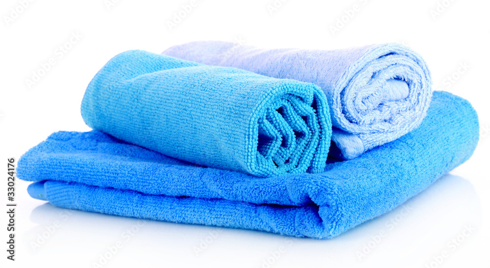 stacked colorful towels on a white background stacked colorful towels on a white background