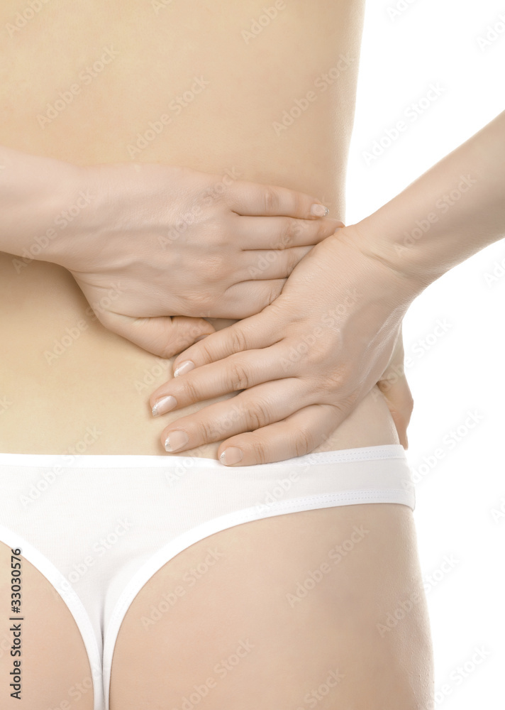Woman massaging pain back, isolated over a white