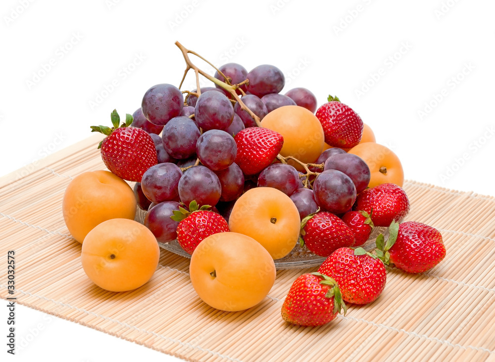 still life of fruit. fresh apricots, grapes and strawberries still life of fruit. fresh apricots, grapes and strawberries