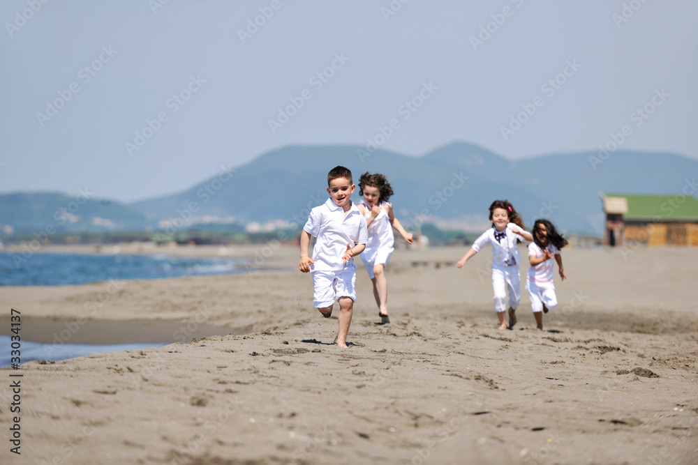 happy child group playing on beach happy child group playing on beach