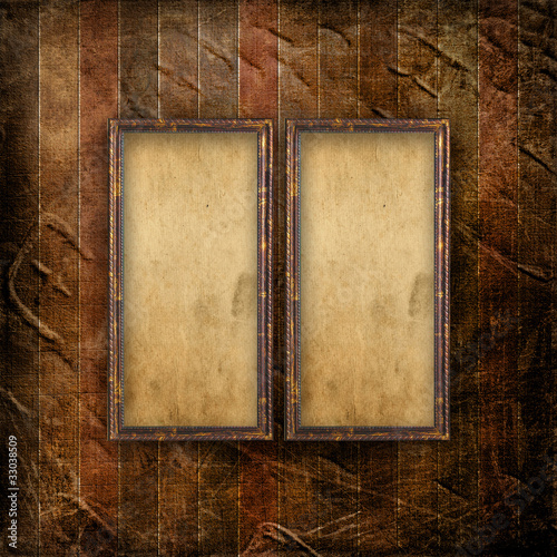 Old grunge frames on the ancient paper background