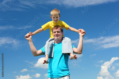 father with son in summer day outdoors