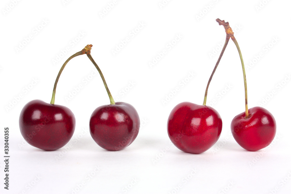 Red cherries isolated on a white background Red cherries isolated on a white background