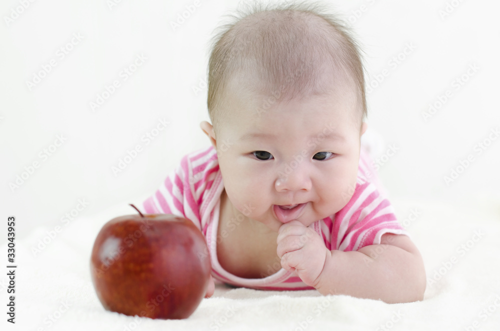 Baby girl with an apple Baby girl with an apple