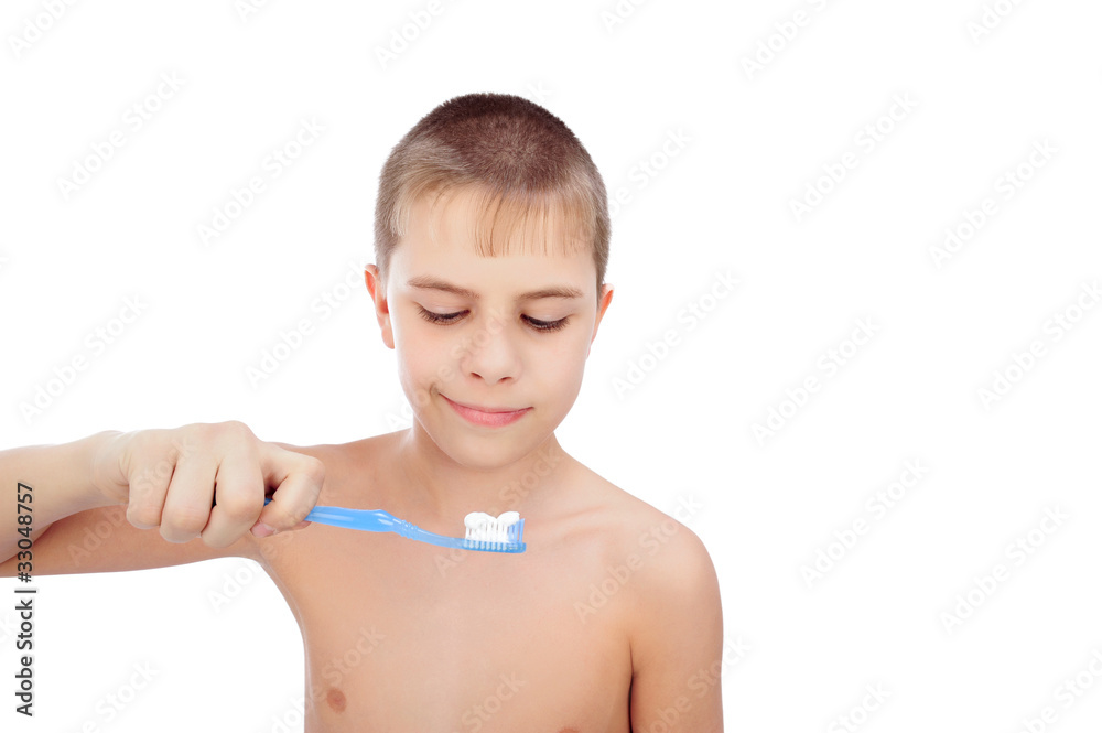 Beautiful boy brushing teeth, isolated on white Beautiful boy brushing teeth, isolated on white