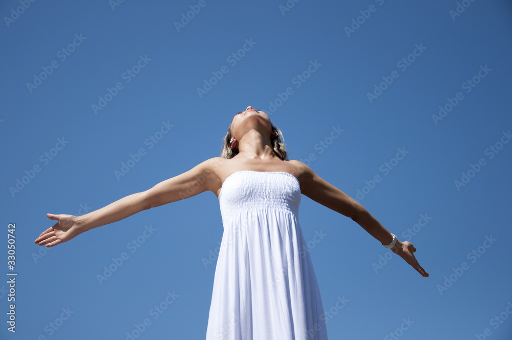 woman having stretched hands aspires in the sky woman having stretched hands aspires in the sky