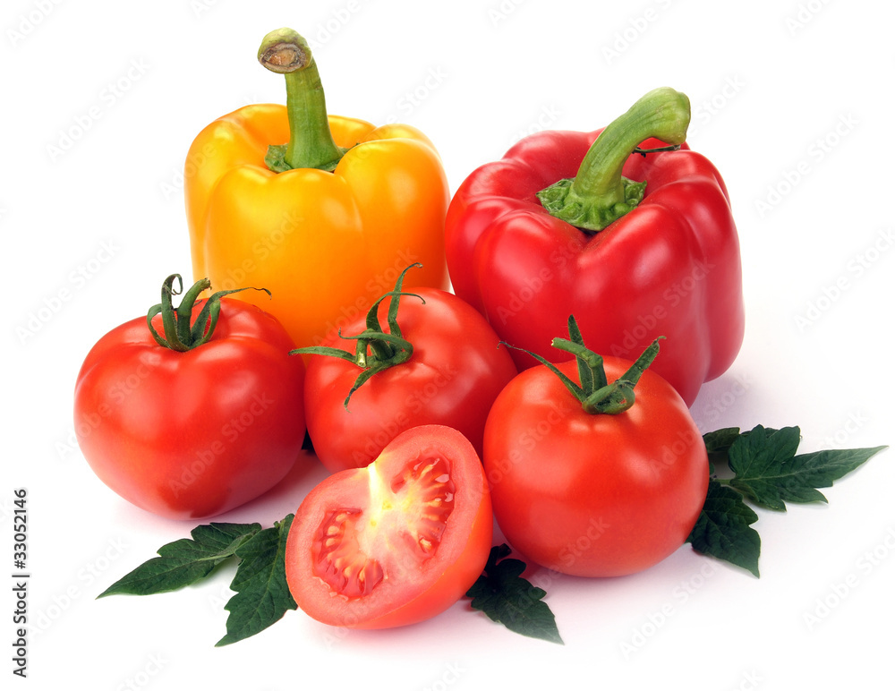 tomatoes and peppers with leaves