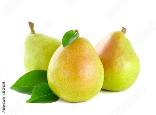 Fresh pear with green leaves isolated on white background