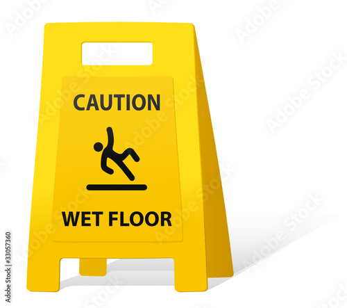 yellow caution sign wet floor