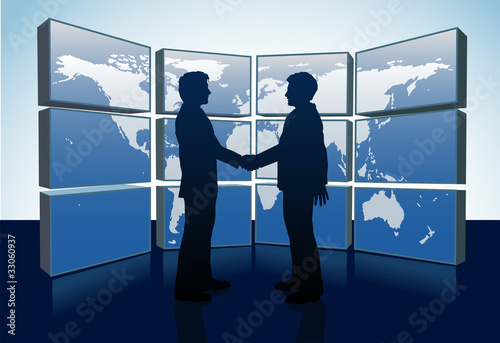 Business people handshake world map monitors