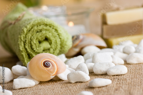 Spa setting with natural soaps and lotus flower.