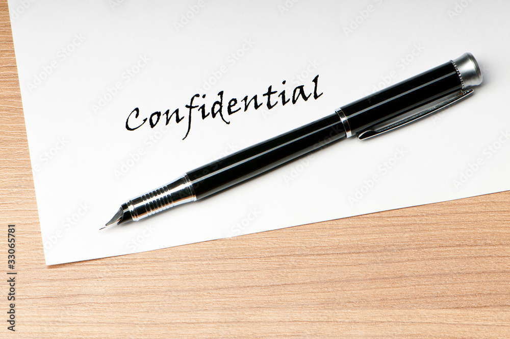 Pen and confidential message on white Pen and confidential message on white