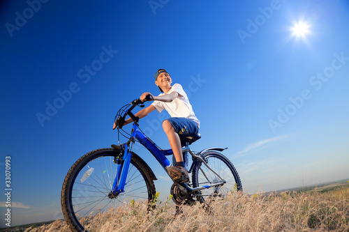 The boy with a bicycle