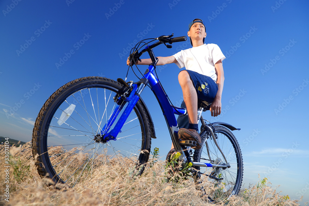 The boy with a bicycle