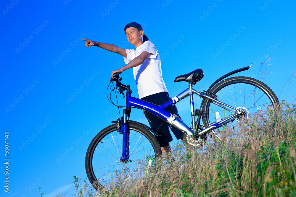 The boy with a bicycle