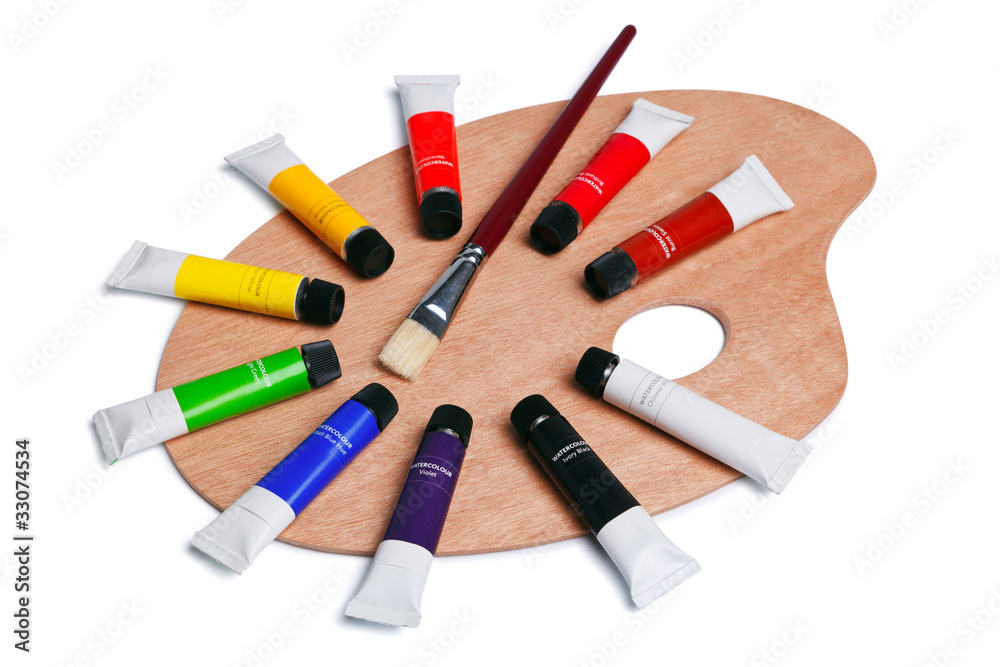 Fototapeta premium Wooden palette with tubes of paint isolated on white