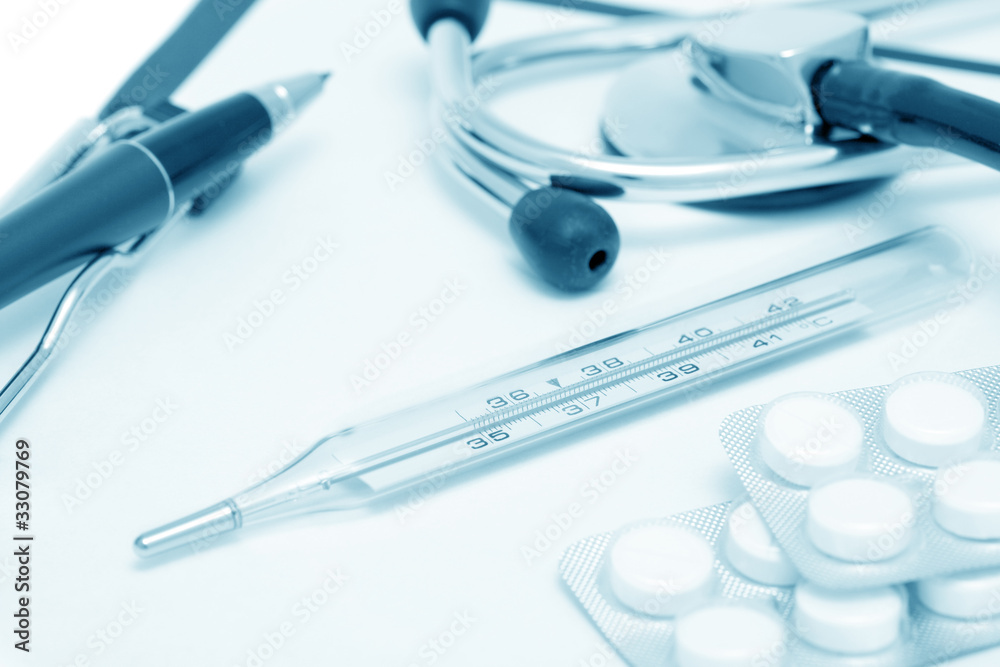 Medical still-life with thermometer and tablets (blue toned) Medical still-life with thermometer and tablets (blue toned)
