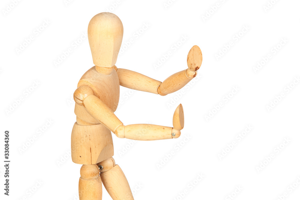 Jointed wooden mannequin pushing something Jointed wooden mannequin pushing something
