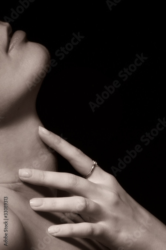 Young woman with touching her neck