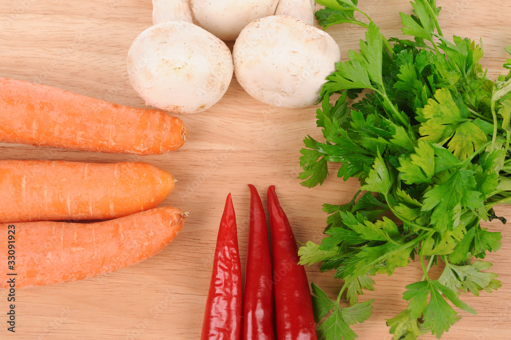 green salad carrot musrooms pepper on cutting board green salad carrot musrooms pepper on cutting board