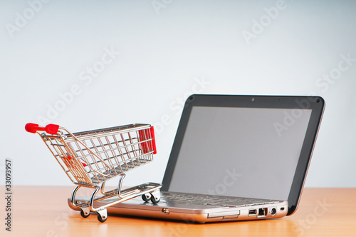 Internet online shopping concept with computer and cart