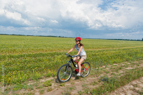 Woman having bicycle trip outdoors