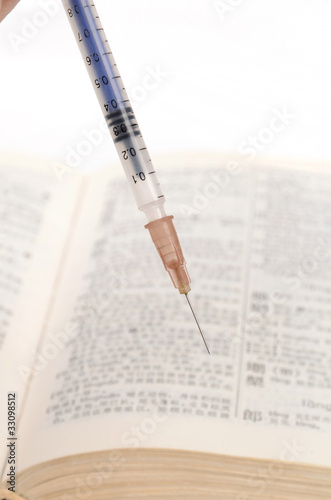 syringe and dictionary