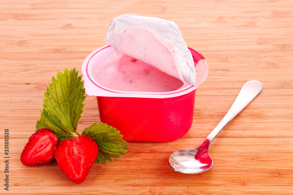 yogurt and strawberry on a wooden background yogurt and strawberry on a wooden background