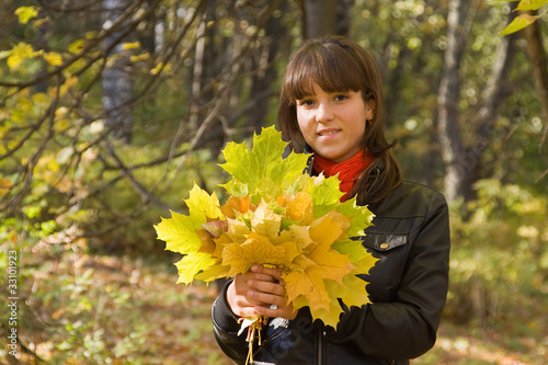 girl with maple leaves photo