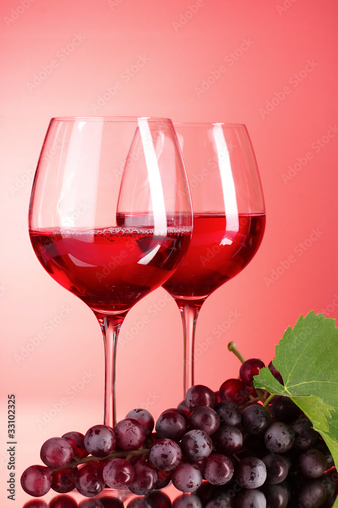 Wine bottle and glass on red background Wine bottle and glass on red background