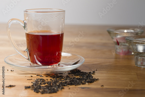 cup of black tea on wooden table