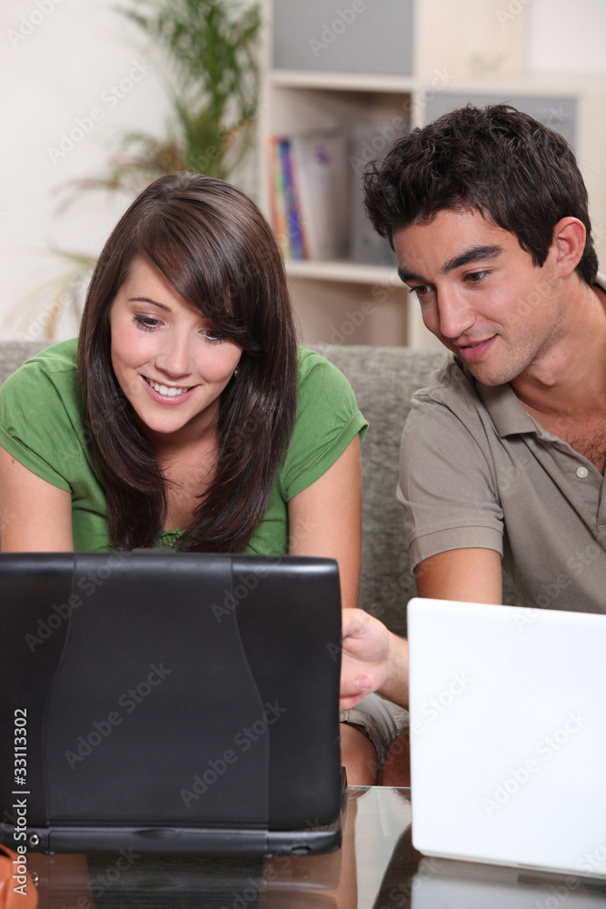Young couple with their laptop computers