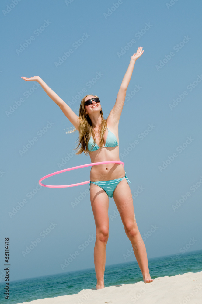 Happy summer vacation - girl playing on the beach Happy summer vacation - girl playing on the beach