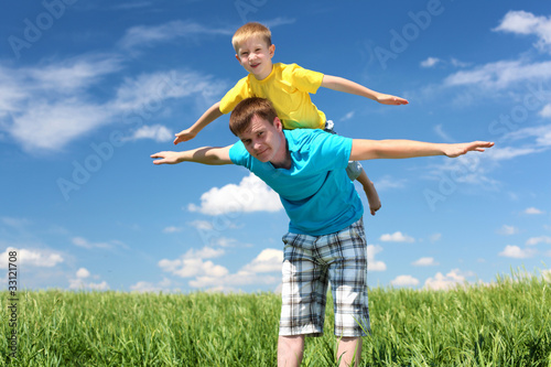 father with son in summer day outdoors