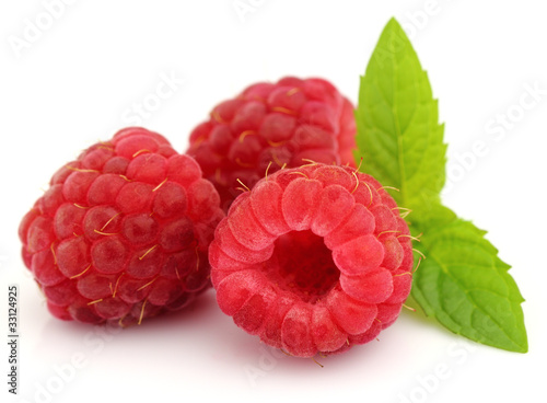 Fresh ripe raspberry with leaves of mint
