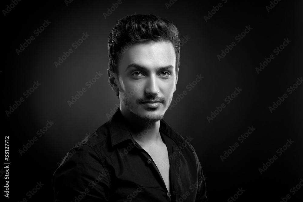 Obraz premium Young man's portrait in back