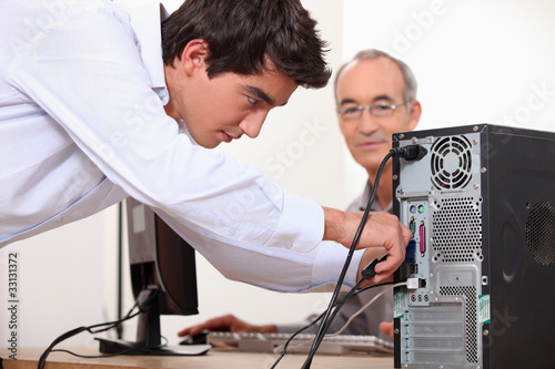 Man fixing a computer