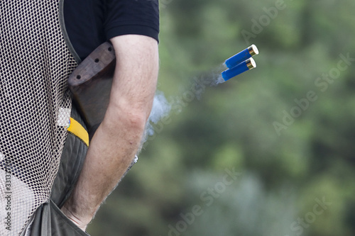 Shotgun throwing its shell