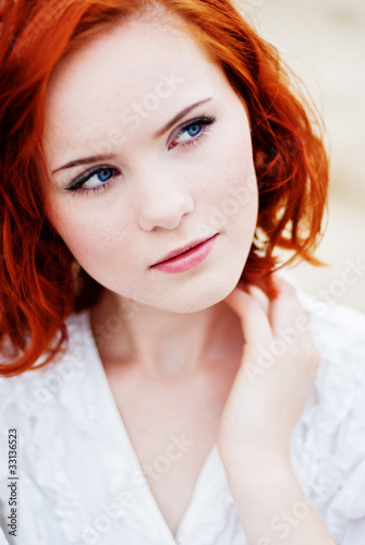 Portrait of young redhead woman
