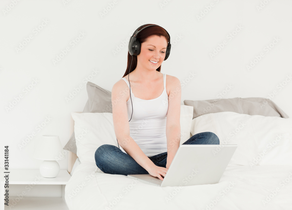 Cute woman relaxing with her laptop Cute woman relaxing with her laptop