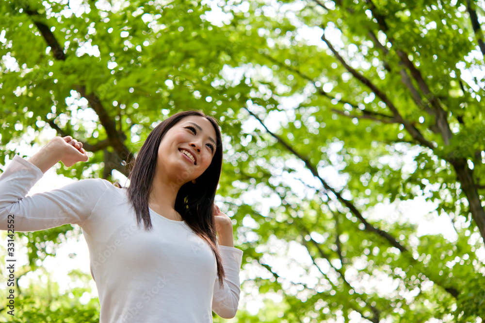 beautiful asian woman in the forest