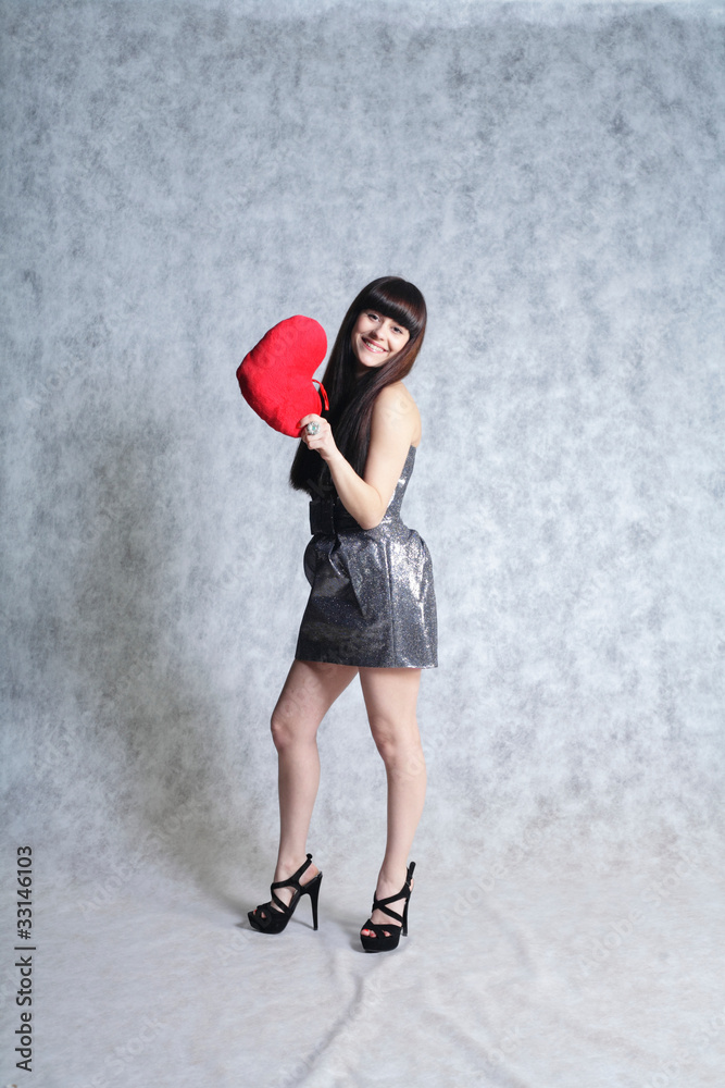 Beautiful Young Woman Holding Red Heart