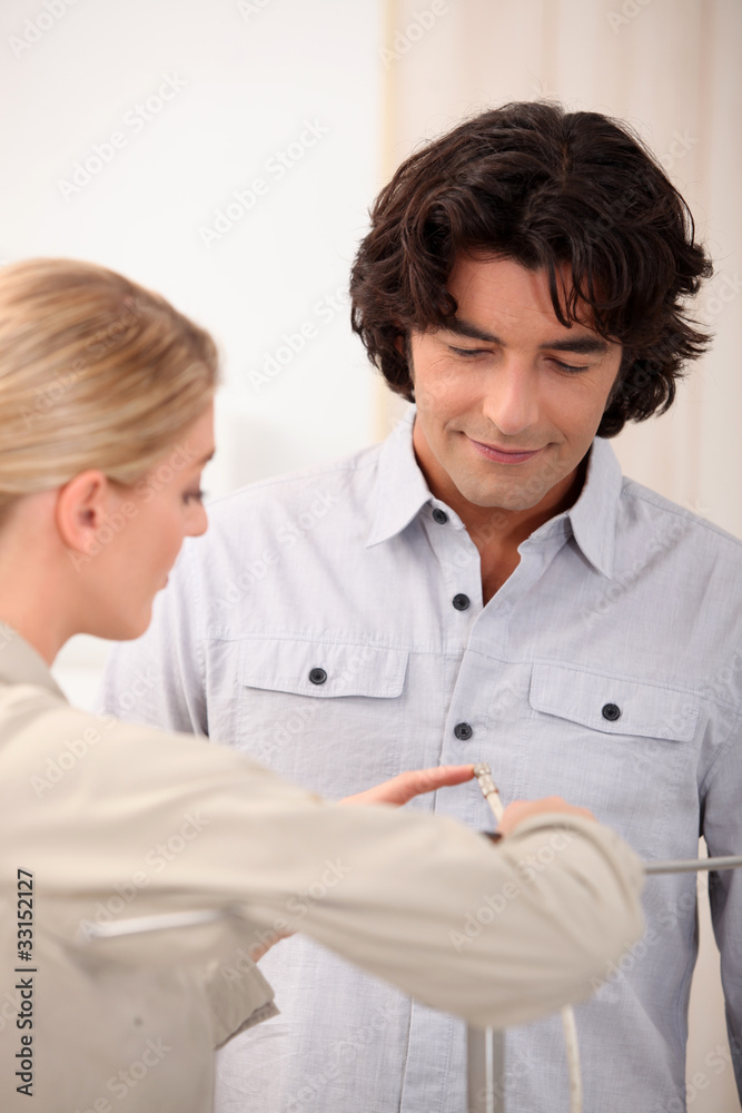 Man and woman looking in detail at something Man and woman looking in detail at something
