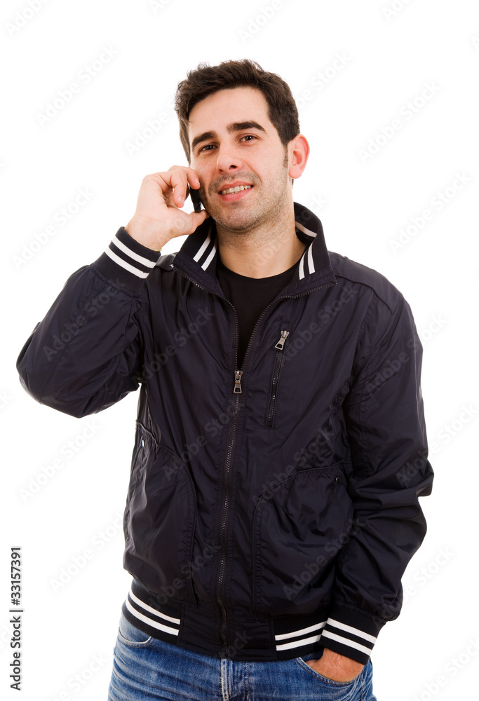 Handsome young man talking on the phone, isolated on white Handsome young man talking on the phone, isolated on white