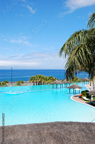 Fototapeta Naklejka Na Ścianę i Meble -  Swimming pool with jacuzzi and beach of luxury hotel, Tenerife i