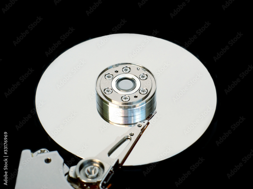 Computer hard disk with opened cover isolated on black Computer hard disk with opened cover isolated on black