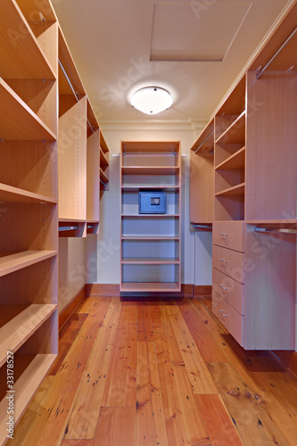 Large Empty walk-in closet with a safe
