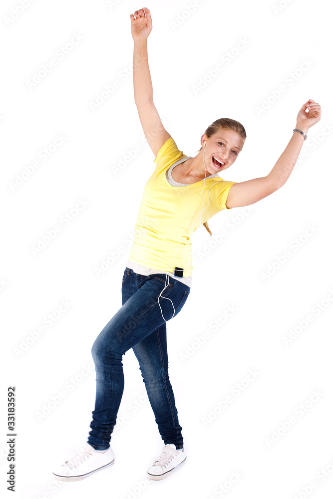 Happy teen enjoying music and dancing