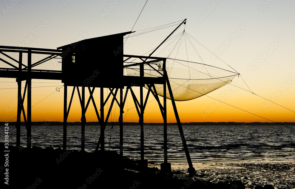 pier with fishing net during sunrise, Gironde Department, France