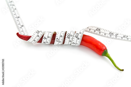 Long red chili and measure tape